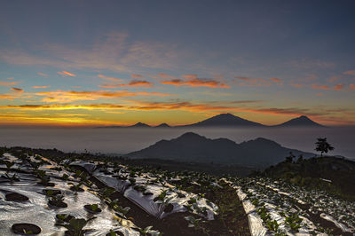 Scenic view of mountains against sky during sunset