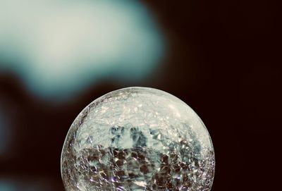 Close-up of bubbles against sky