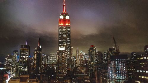 Low angle view of skyscrapers lit up at night