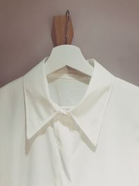 Close-up of clothes hanging over white background