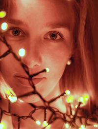 Close-up portrait of woman with light painting