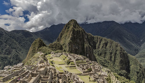 Scenic view of mountains against cloudy sky