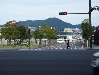 Road in city against sky