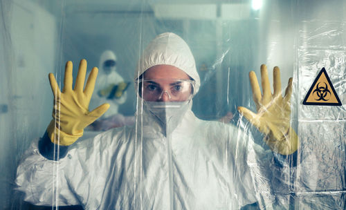 Portrait of woman wearing protective suit at hospital