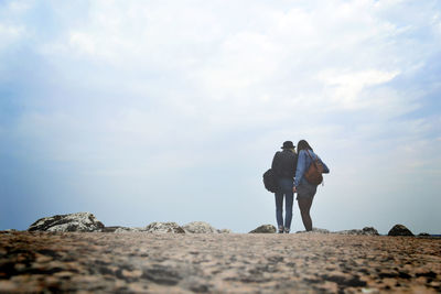 Surface level view of women against sky