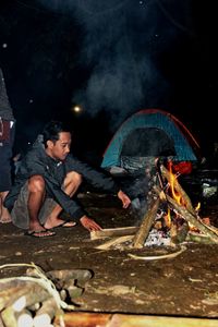 A man burns a bonfire