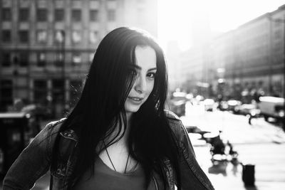 Portrait of beautiful woman in city