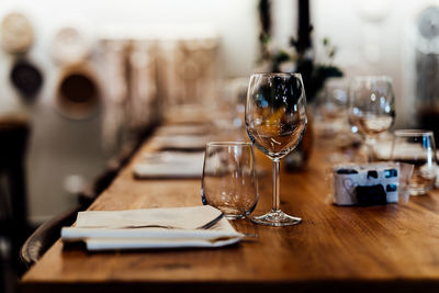 Luxury table settings for fine dining with and glassware, beautiful blurred background. 