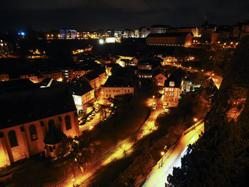 High angle view of illuminated city street at night