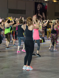 Group of people dancing at music concert