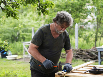 Full length of man standing in yard