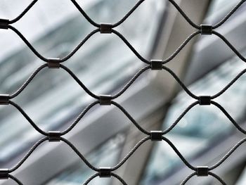 Full frame shot of chainlink fence against sky