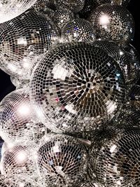 Low angle view of illuminated lighting equipment at night