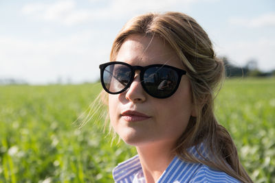 Blond woman wearing sunglasses outdoors