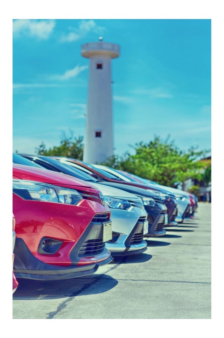 car, transportation, mode of transport, sky, street, day, road, land vehicle, outdoors, red, blue, no people, tree, built structure, architecture, close-up, city