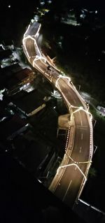 High angle view of illuminated road at night