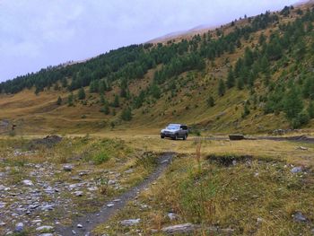 Car on land against mountain