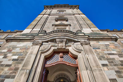 Low angle view of building against blue sky