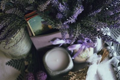 High angle view of candle and lavender on table