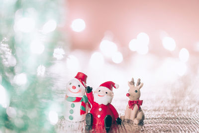 Close-up of figurine with toys