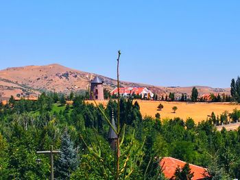 View of townscape against blue sky