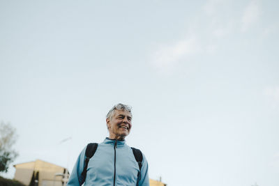 Smiling man looking away