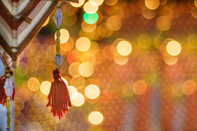 Close-up of illuminated christmas lights hanging on tree