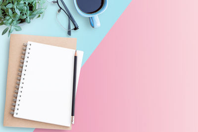 High angle view of pen and book on table