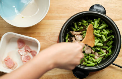 High angle view of person preparing food in bowl