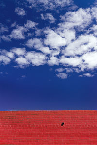 Low angle view of building against blue sky