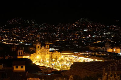 High angle shot of illuminated townscape against sky at night