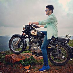 Side view of young man riding bicycle