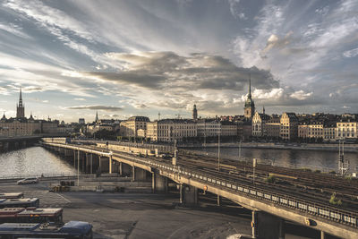 View of bridge over river against cloudy sky