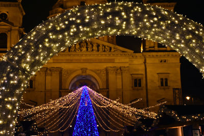 Low angle view of illuminated building at night