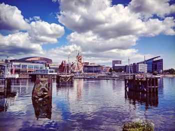 Panoramic view of river and buildings against sky