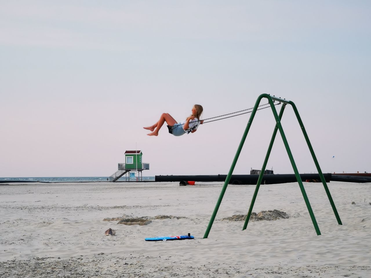 water, beach, sky, nature, sand, land, one person, full length, sea, day, copy space, wind, men, jumping, leisure activity, childhood, motion, outdoors, lifestyles, adult, fun, sports, side view, holiday, playground, clear sky, child, boardsport
