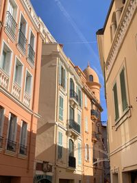 Low angle view of buildings against blue sky in monaco