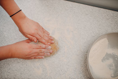 Cropped hand of person washing hands