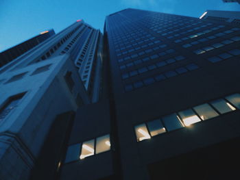 Low angle view of office building against sky