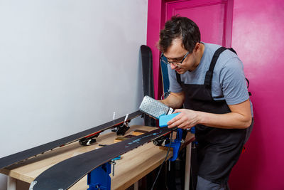 Rear view of man working at home