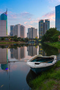 Boats moored at reservoir