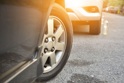 Close-up of cars on road