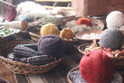 Close-up of colorful threads with food for sale at market