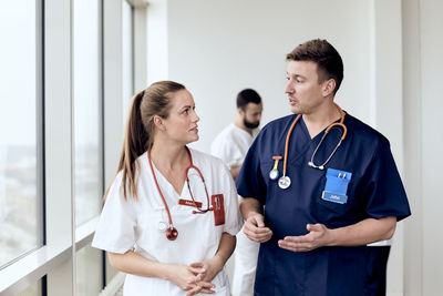 Doctors talking on corridor