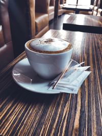 Close-up of coffee cup on table