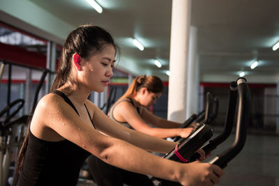 Young women exercising in gym