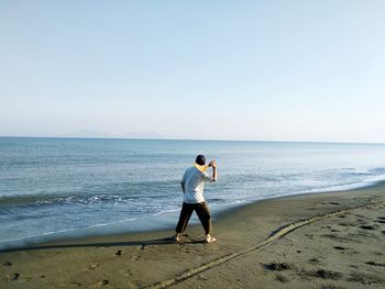 Playing a boomerang at the beach