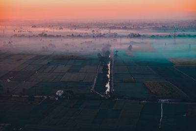 High angle view of cityscape against sky during sunset