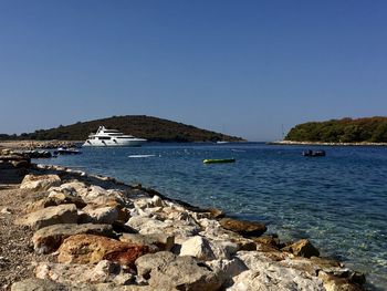 Scenic view of sea against clear blue sky