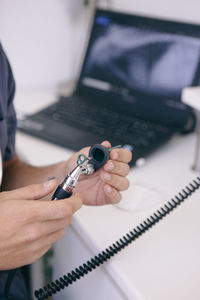 Close-up of man using mobile phone